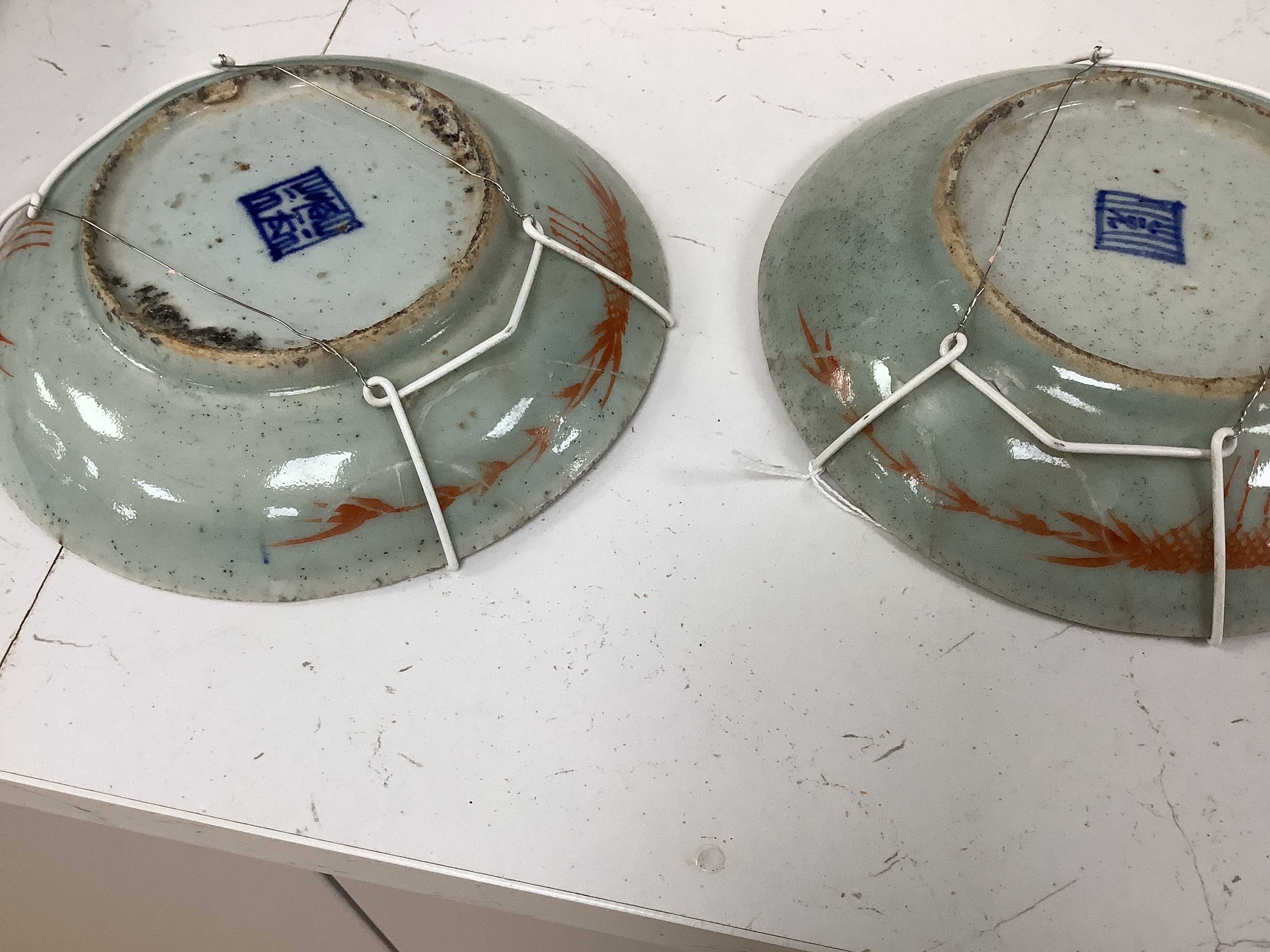 Eight 19th century Chinese celadon glazed famille rose dishes, largest 26cm